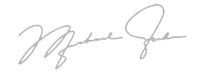 A handwritten signature in gray ink on a transparent background.